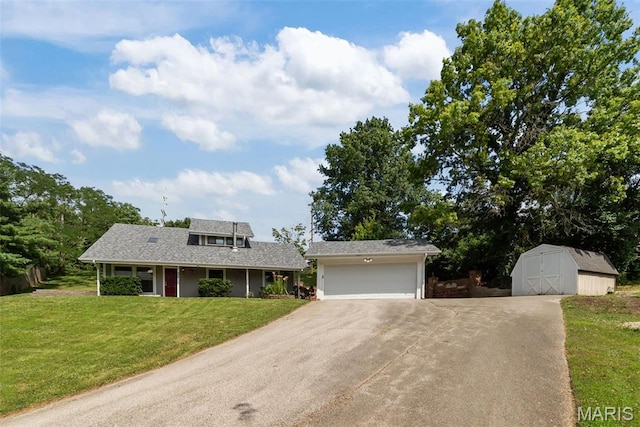 404 Applestone Dr, Ballwin, MO 63021 - view of front of property with asphalt driveway, an attached garage, a shed, and a front lawn