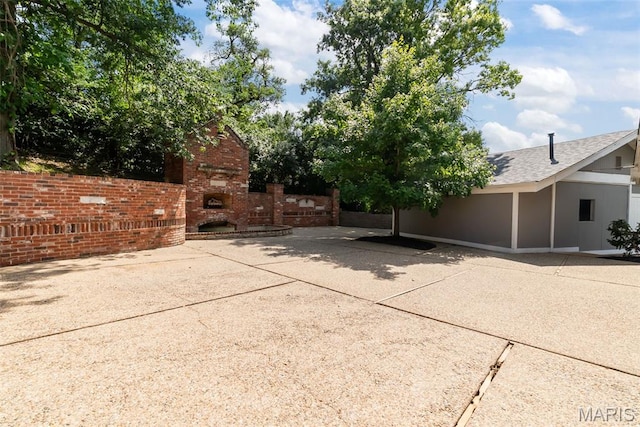 404 Applestone Dr, Ballwin, MO 63021 - view of patio / terrace with a fireplace