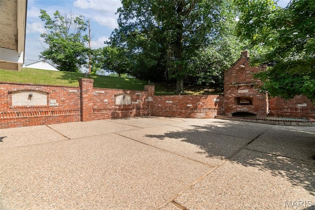 404 Applestone Dr, Ballwin, MO 63021 - view of patio with a fireplace