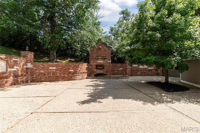 404 Applestone Dr, Ballwin, MO 63021 - view of patio with an outdoor fireplace