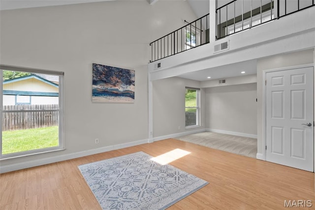 404 Applestone Dr, Ballwin, MO 63021 - unfurnished living room with a high ceiling and wood finished floors