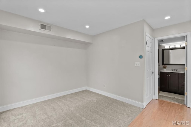 404 Applestone Dr, Ballwin, MO 63021 - empty room featuring recessed lighting and light wood-style flooring