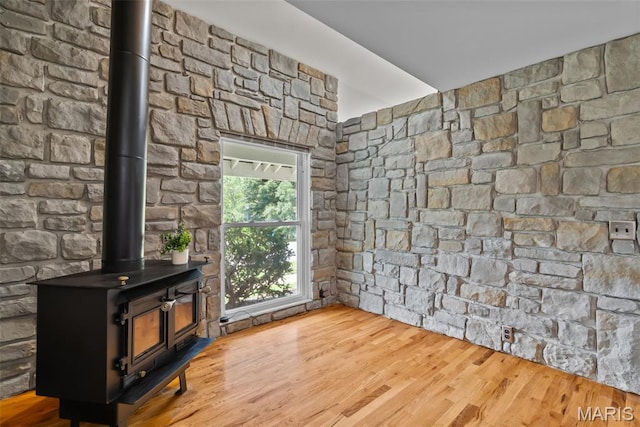 404 Applestone Dr, Ballwin, MO 63021 - unfurnished living room with a wood stove and wood finished floors