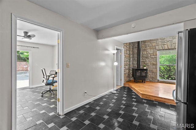 404 Applestone Dr, Ballwin, MO 63021 - living room with a wood stove and baseboards