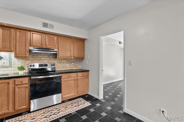 404 Applestone Dr, Ballwin, MO 63021 - kitchen with electric range, under cabinet range hood, dark countertops, backsplash, and dark flooring