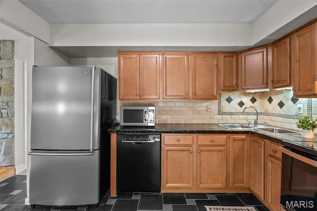 404 Applestone Dr, Ballwin, MO 63021 - kitchen featuring appliances with stainless steel finishes, dark countertops, decorative backsplash, and brown cabinets