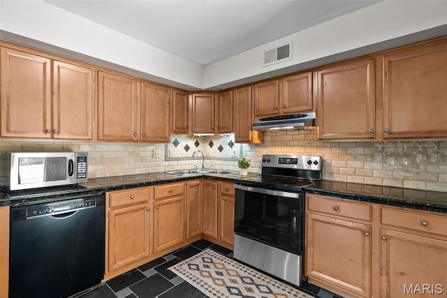 404 Applestone Dr, Ballwin, MO 63021 - kitchen with stainless steel appliances, under cabinet range hood, and tasteful backsplash