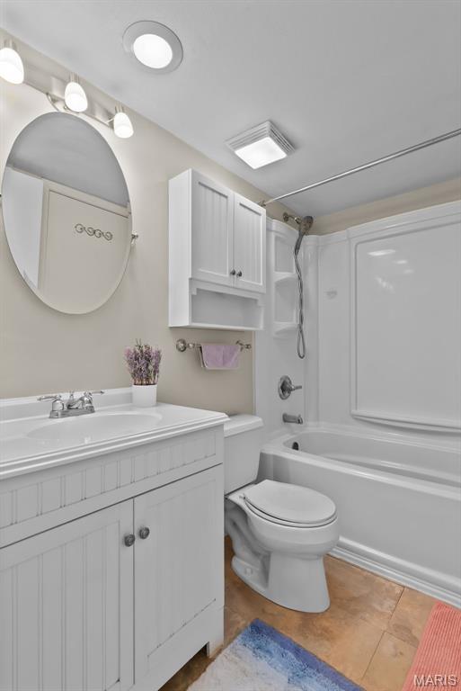 404 Applestone Dr, Ballwin, MO 63021 - full bath with vanity, shower / washtub combination, and tile patterned flooring