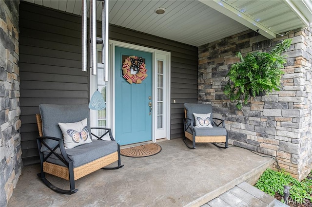 12200 Country Oaks Dr, Rolla, MO 65401 - entrance to property featuring covered porch and stone siding