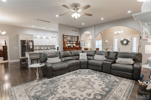 12200 Country Oaks Dr, Rolla, MO 65401 - living room featuring arched walkways, a chandelier, dark wood finished floors, a ceiling fan, and recessed lighting
