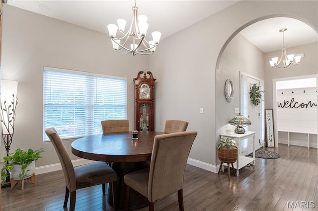 12200 Country Oaks Dr, Rolla, MO 65401 - dining room featuring a chandelier, wood-type flooring, and arched walkways