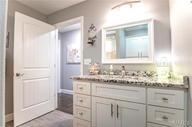 12200 Country Oaks Dr, Rolla, MO 65401 - bathroom featuring vanity and baseboards