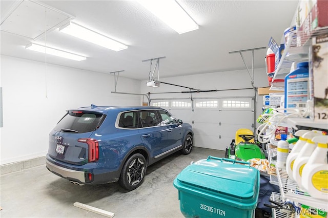 12200 Country Oaks Dr, Rolla, MO 65401 - garage featuring a garage door opener
