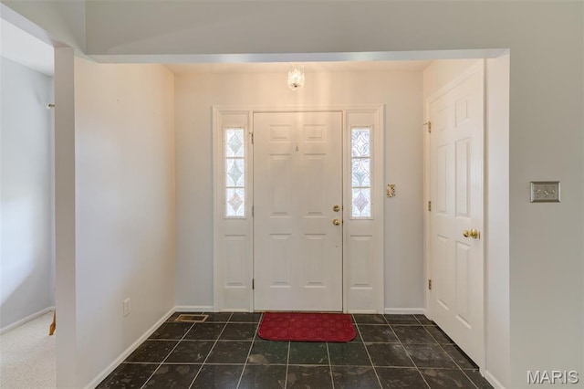 1733 Forest Trace Dr, Ofallon, MO 63368 - entrance foyer featuring baseboards and dark tile patterned floors