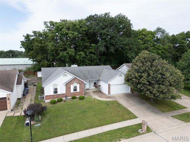 1733 Forest Trace Dr, Ofallon, MO 63368 - view of front of home featuring brick siding, driveway, a garage, and a front yard
