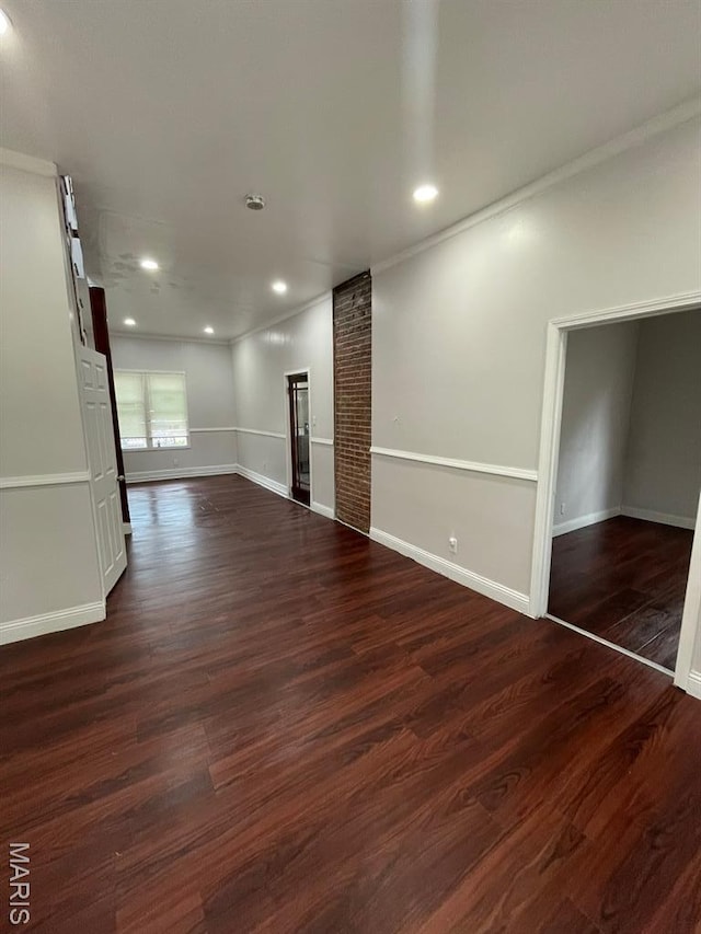 5350 Claxton Ave, Saint Louis, MO 63120 - unfurnished living room with dark wood-style flooring, recessed lighting, and ornamental molding