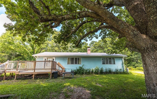 21535 State Route K, Beulah, MO 65436 - view of front of property featuring a front lawn, a wooden deck, and a chimney