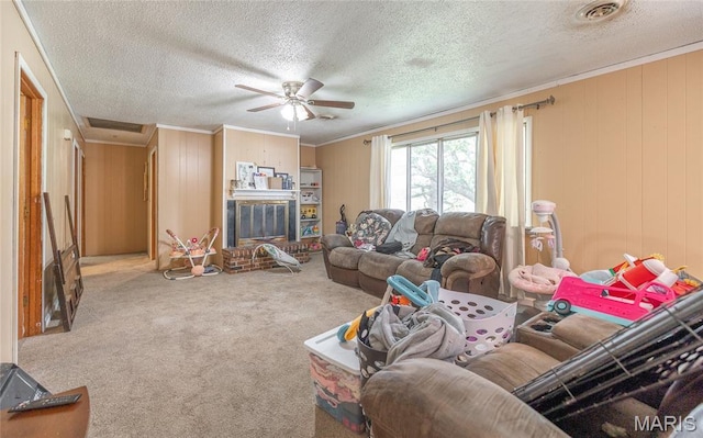 21535 State Route K, Beulah, MO 65436 - carpeted living area featuring ornamental molding, a ceiling fan, a textured ceiling, wood walls, and a brick fireplace