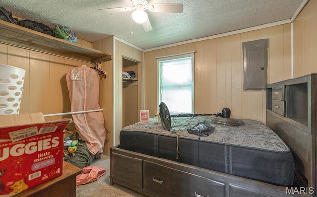 21535 State Route K, Beulah, MO 65436 - bedroom featuring electric panel, carpet, a textured ceiling, a ceiling fan, and wood walls