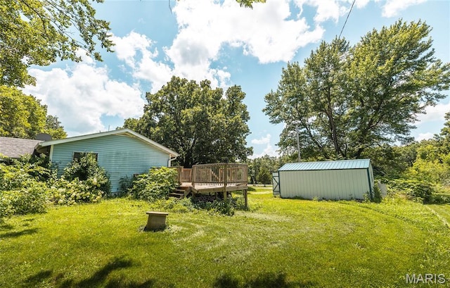 21535 State Route K, Beulah, MO 65436 - view of green lawn featuring a wooden deck, an outdoor structure, and a pole building