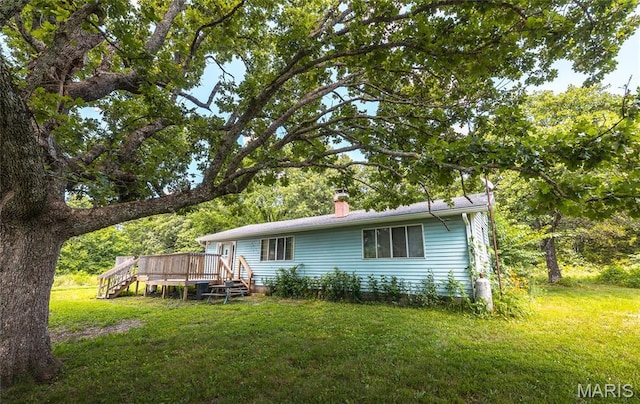 21535 State Route K, Beulah, MO 65436 - rear view of house featuring a wooden deck, a yard, and a chimney