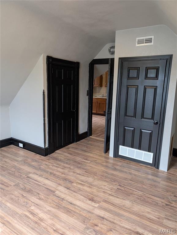 506 N 17th St, Belleville, IL 62226 - bonus room featuring vaulted ceiling and wood finished floors