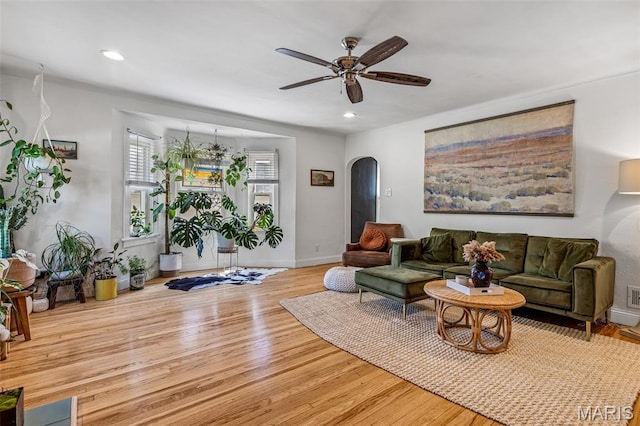 302 Donnelly St, De Soto, MO 63020 - living room featuring arched walkways, wood finished floors, a ceiling fan, and recessed lighting