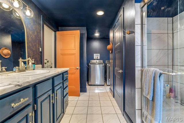 302 Donnelly St, De Soto, MO 63020 - bathroom featuring independent washer and dryer, vanity, recessed lighting, a shower stall, and marble finish flooring