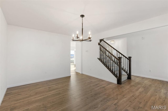 807 Colony Ridge Ct, Foristell, MO 63348 - spare room with a chandelier, wood finished floors, and stairway