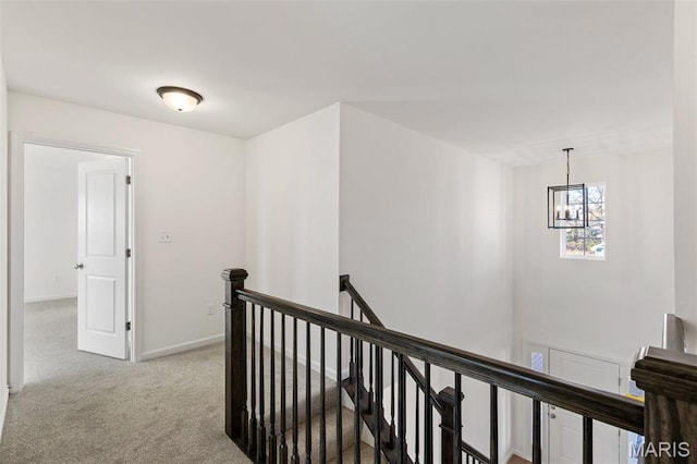 807 Colony Ridge Ct, Foristell, MO 63348 - hallway featuring an upstairs landing, carpet, and a chandelier