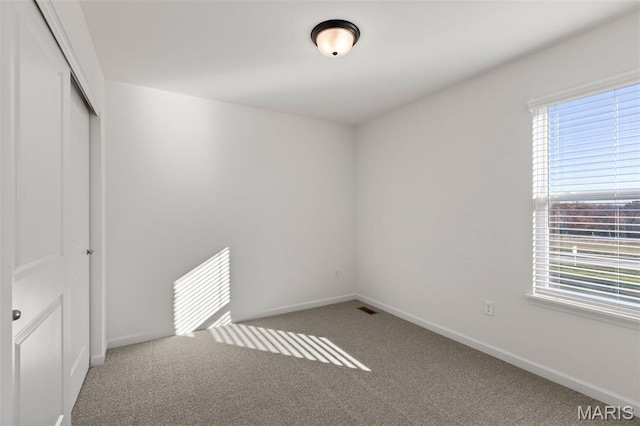 807 Colony Ridge Ct, Foristell, MO 63348 - unfurnished bedroom featuring carpet flooring, multiple windows, and a closet