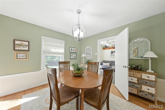 7142 Circleview Dr, Gravois Township, MO 63123 - dining room with light wood finished floors and a chandelier