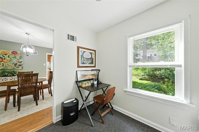 7142 Circleview Dr, Gravois Township, MO 63123 - home office featuring plenty of natural light, a chandelier, and dark colored carpet