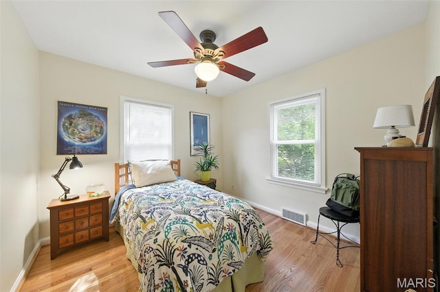 7142 Circleview Dr, Gravois Township, MO 63123 - bedroom featuring light wood finished floors and a ceiling fan