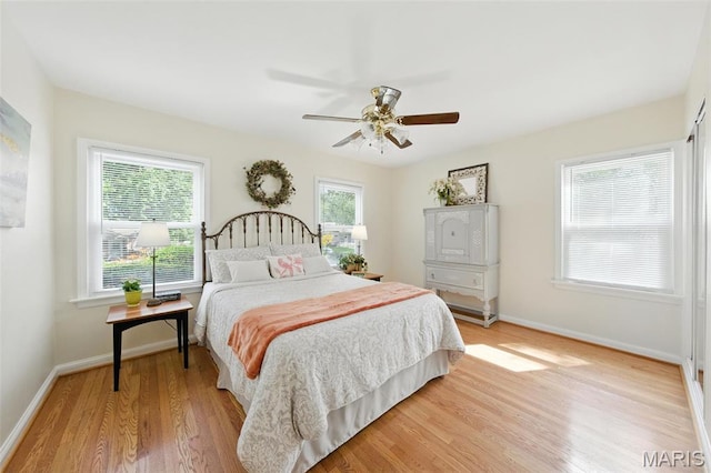 7142 Circleview Dr, Gravois Township, MO 63123 - bedroom featuring light wood finished floors and a ceiling fan