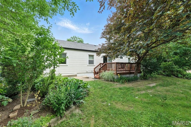 7142 Circleview Dr, Gravois Township, MO 63123 - rear view of house with a deck, a yard, and roof with shingles