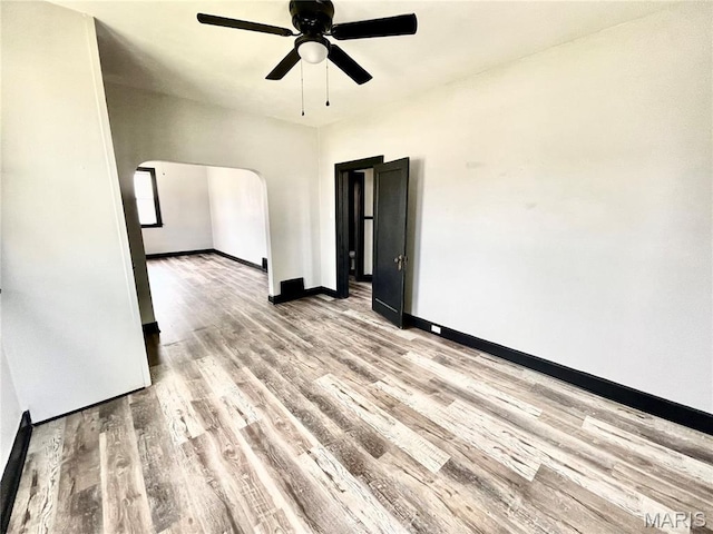 1519 Lebanon Ave, Belleville, IL 62221 - unfurnished room with a ceiling fan, wood finished floors, and arched walkways