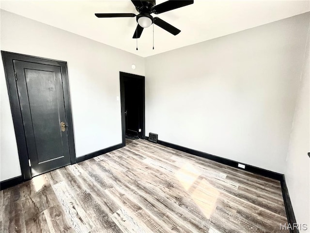 1519 Lebanon Ave, Belleville, IL 62221 - unfurnished bedroom with light wood finished floors and a ceiling fan