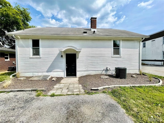 1519 Lebanon Ave, Belleville, IL 62221 - rear view of property featuring a chimney