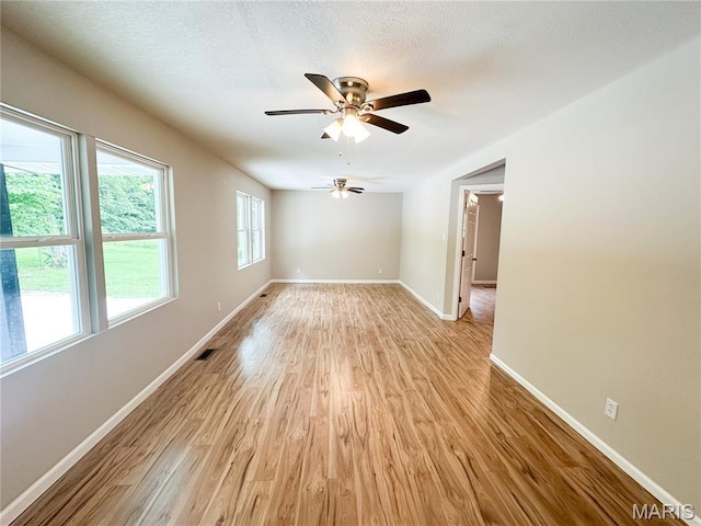 66 County Road 6680, Salem, MO 65560 - empty room featuring light wood finished floors and a ceiling fan