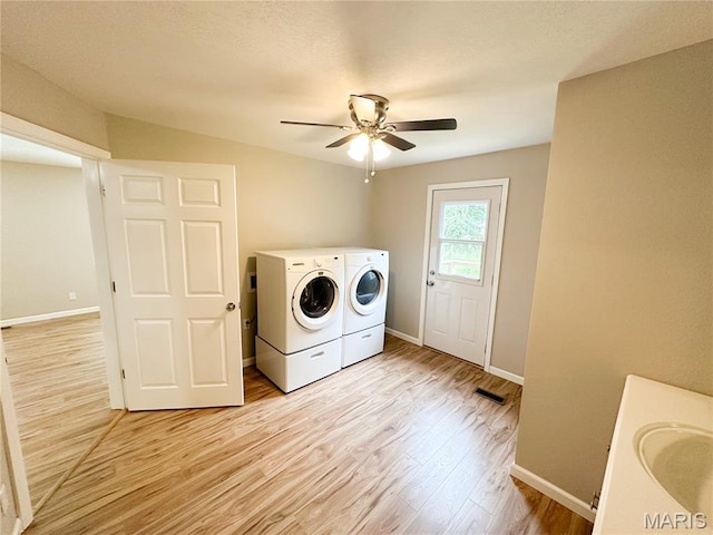66 County Road 6680, Salem, MO 65560 - laundry area with separate washer and dryer, light wood-type flooring, and a ceiling fan