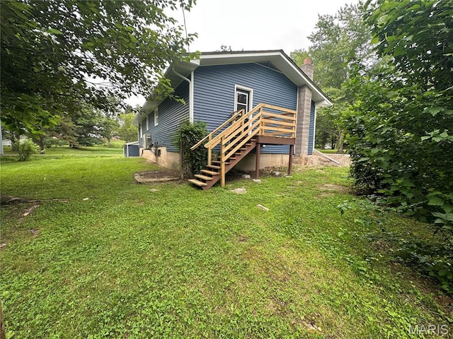 66 County Road 6680, Salem, MO 65560 - back of property with a chimney, a yard, stairs, and a wooden deck