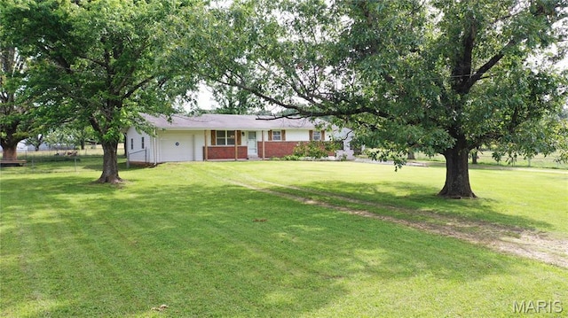 6484 County Road 3180, Salem, MO 65560 - view of front of home with an attached garage, a front yard, and brick siding