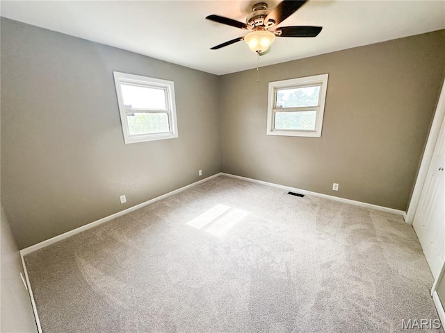 6484 County Road 3180, Salem, MO 65560 - spare room featuring healthy amount of natural light, a ceiling fan, and carpet flooring
