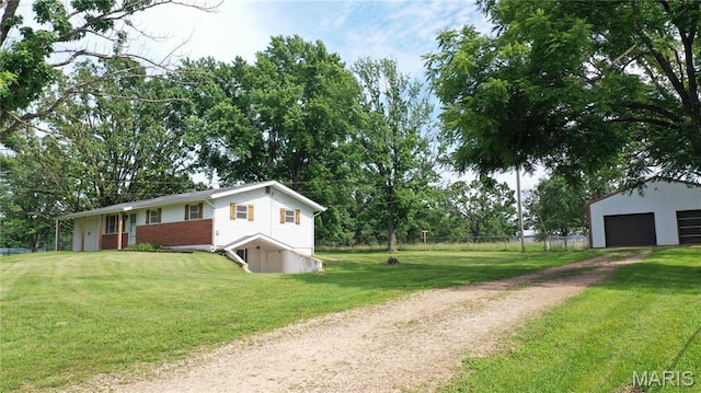 6484 County Road 3180, Salem, MO 65560 - view of front facade featuring dirt driveway, a garage, and an outdoor structure