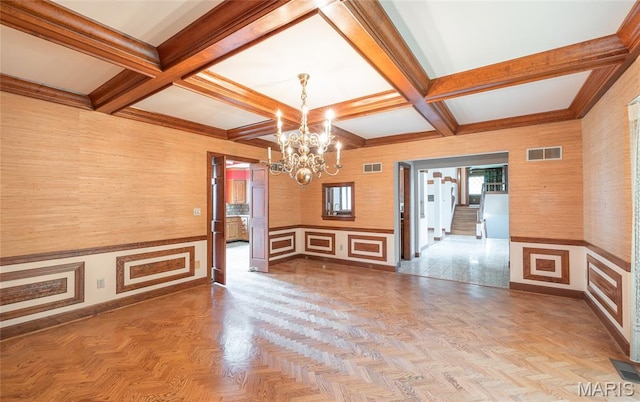 3401 Riverview Ct, Godfrey, IL 62035 - unfurnished dining area featuring a chandelier, coffered ceiling, beamed ceiling, and a decorative wall