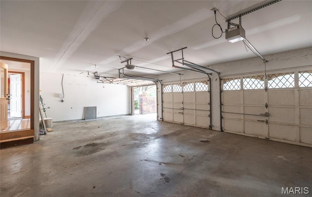 3401 Riverview Ct, Godfrey, IL 62035 - garage featuring a garage door opener