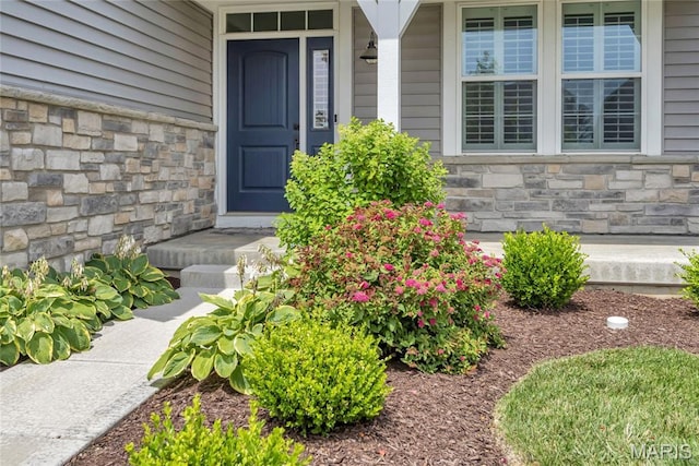 211 Cambium Ct, Wentzville, MO 63385 - doorway to property with stone siding and a porch