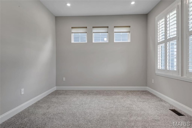 211 Cambium Ct, Wentzville, MO 63385 - carpeted empty room with plenty of natural light and recessed lighting