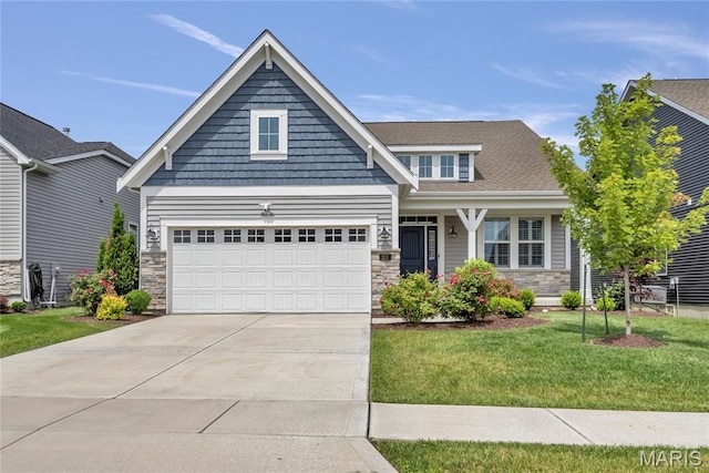 211 Cambium Ct, Wentzville, MO 63385 - craftsman house with stone siding, a front lawn, concrete driveway, and a garage